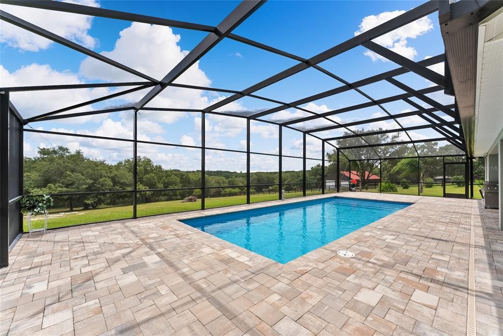 SWIMMING POOL ENCLOSURE features a private view of sloping backyard.