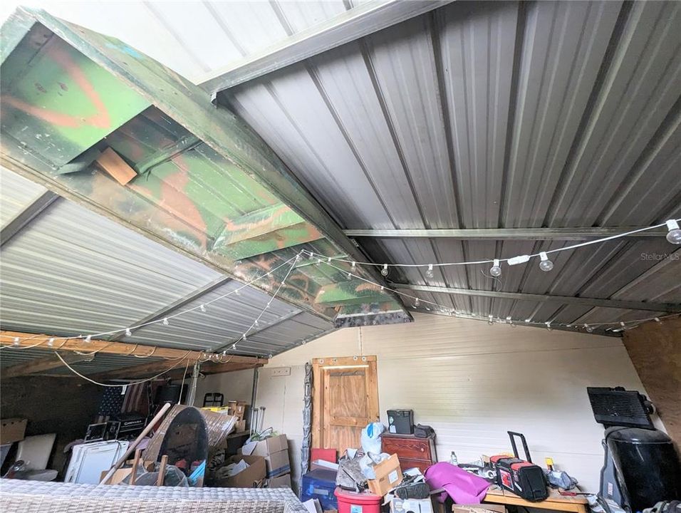 Boat on ceiling in the tiki bar shed