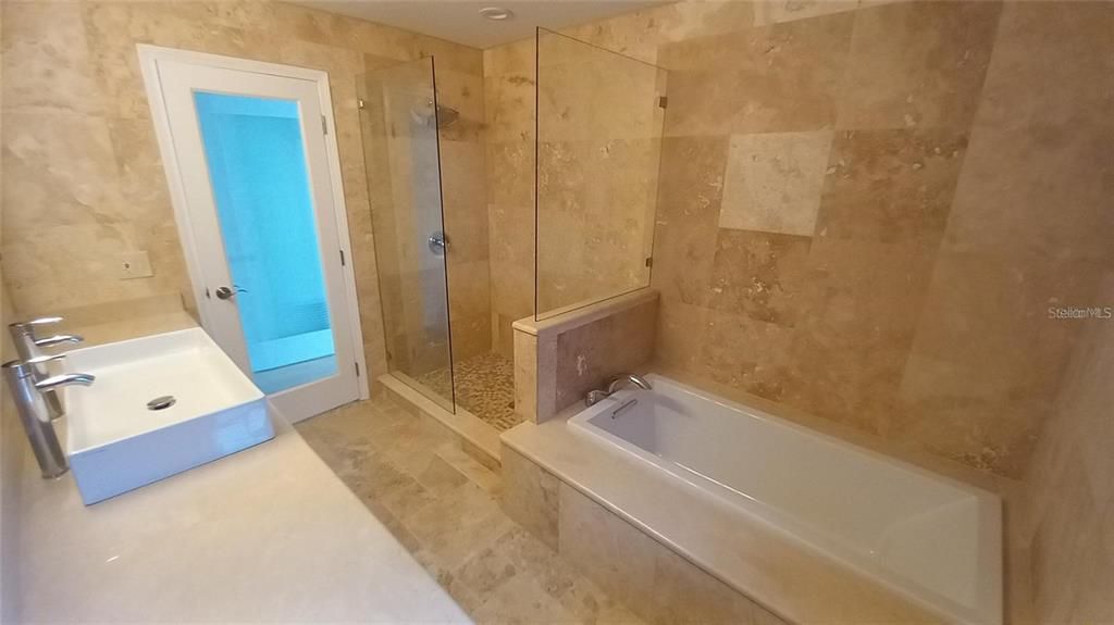 Primary bedroom ensuite bathroom shower and soaker tub