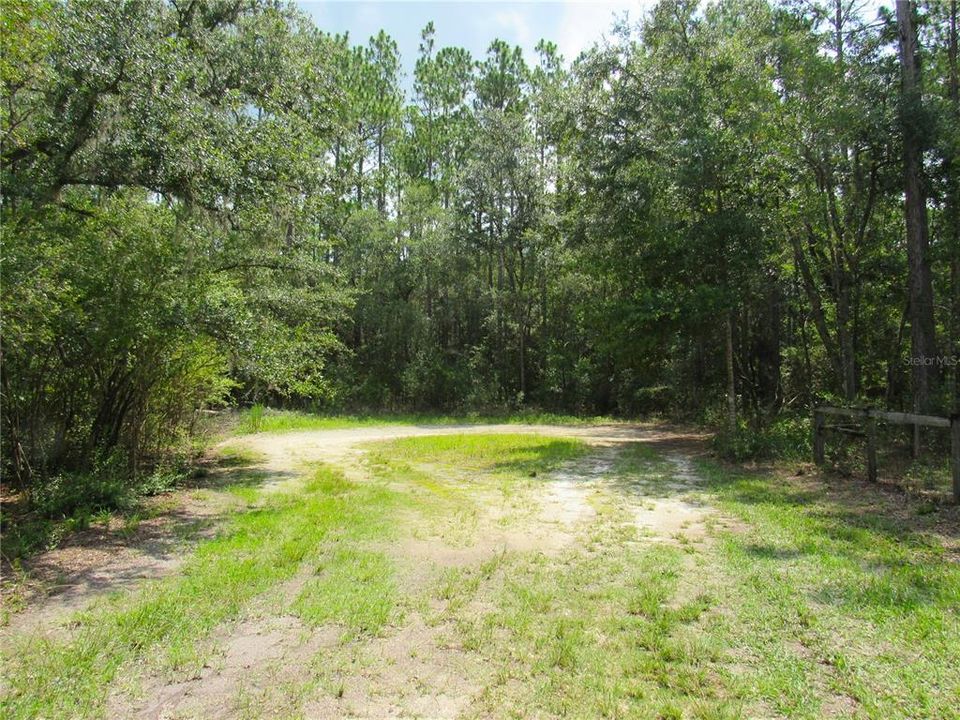 Short Limestone Road (Off Paved Road) to Cul-De-Sac Which is Hard Dirt. Gorgeous Property with 1.33 Acres of Privacy. Within Minutes To Major Highways, Interstates and Shopping Galore but Nestled In The Country From The Hustle and Bustle of The Surrounding Cities...Short Distance To The New World Equestrian Center in Ocala!