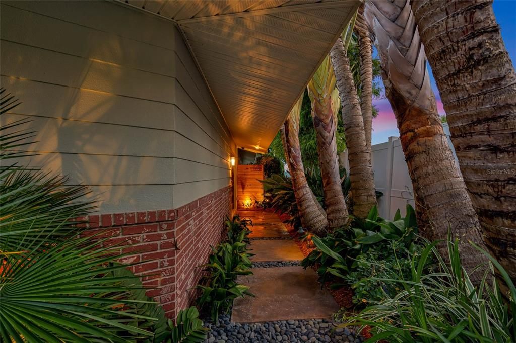 Landscaping and privacy are hallmarks of this beautifully maintained home.
