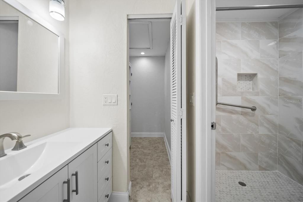 Ensuite and closet with built-in storage from Master