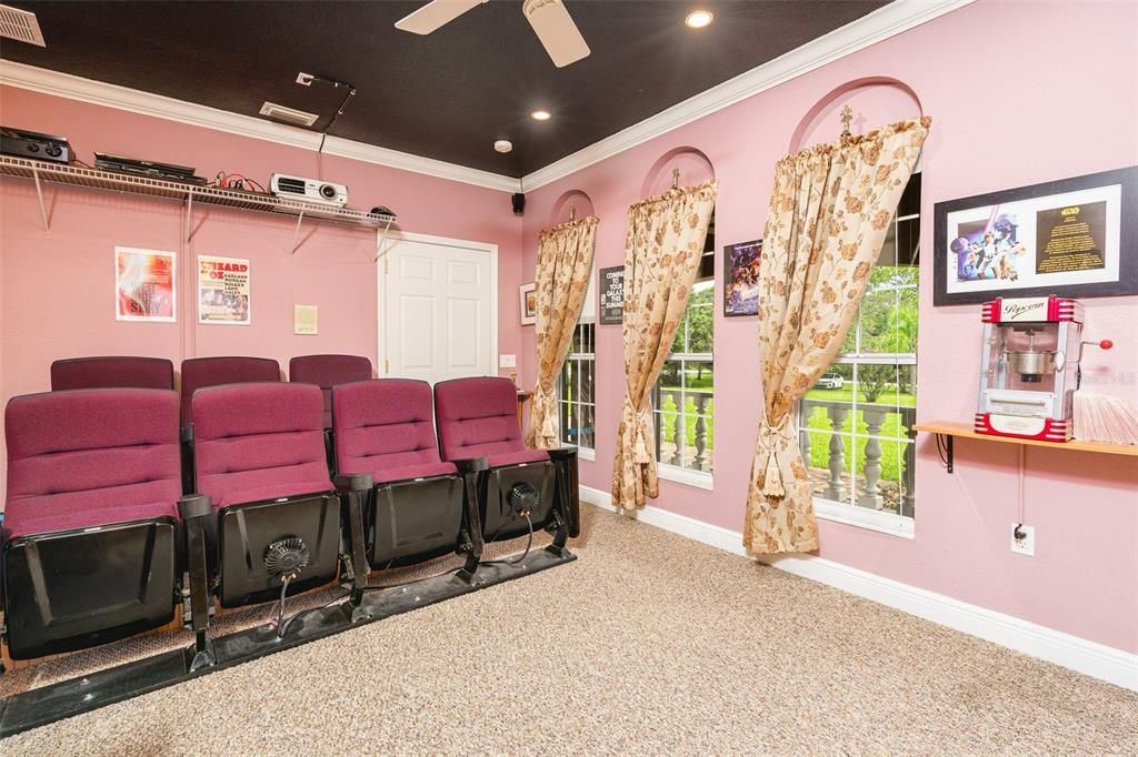chairs in theater room with windos