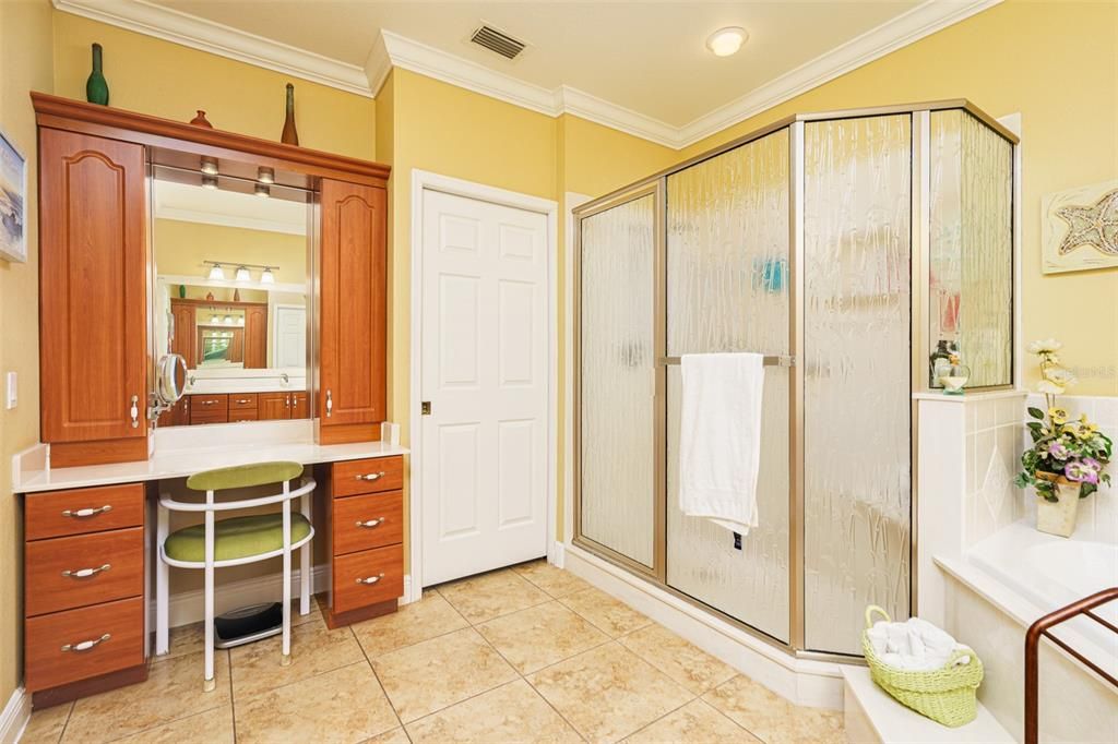 vanity in master bath and private toilet with pocket door.  and seperate shower