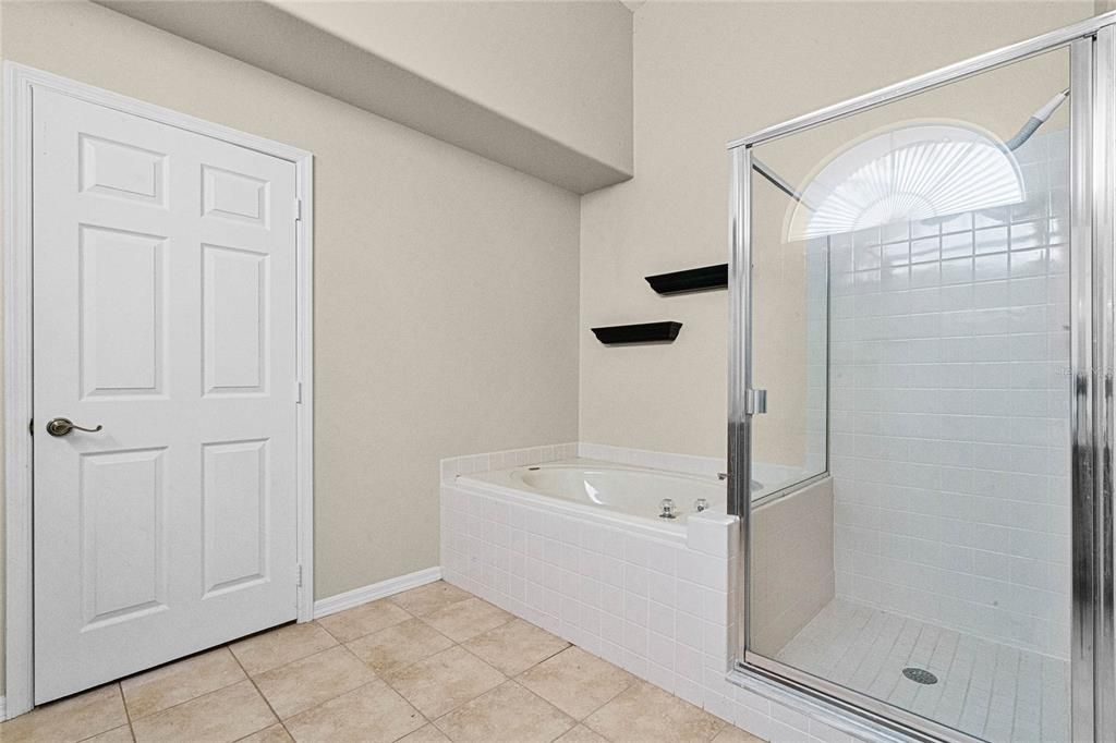 Master bathroom with soaking tub and walk-in shower