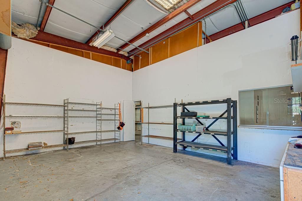 SEPARATE BAY FROM OPEN WAREHOUSE - BREAKROOM BEHIND