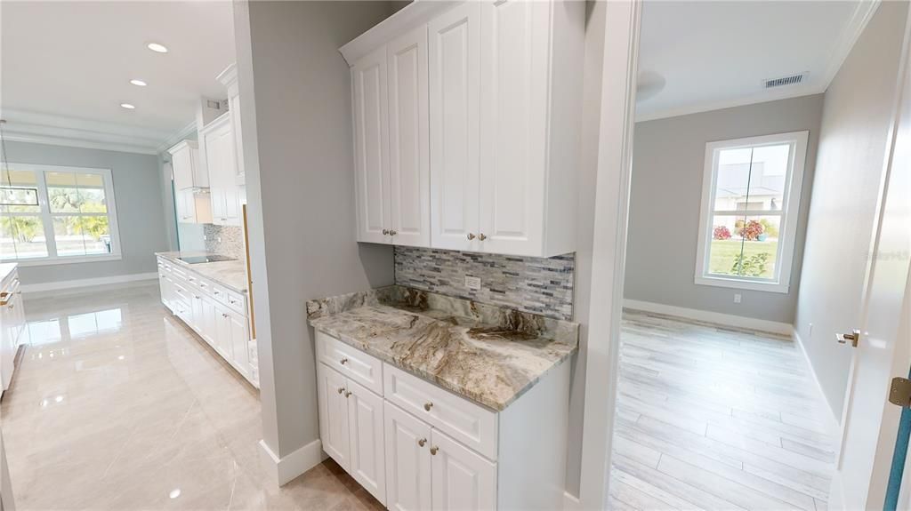 Ensuite guest bedroom off garage foyer