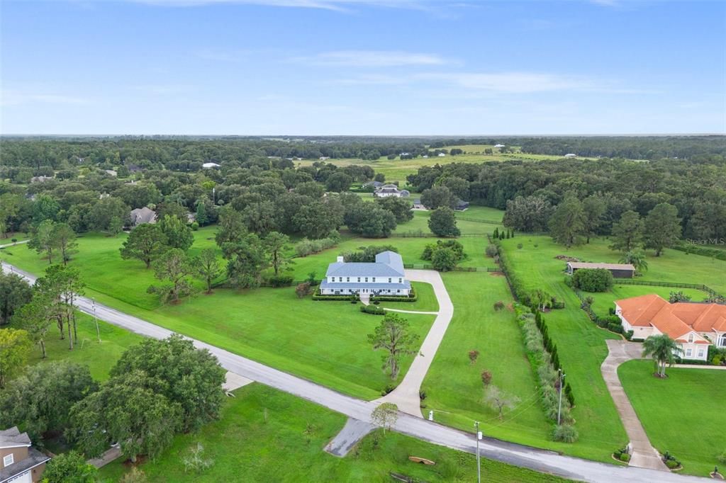 Experience the pleasure of 2.5 acres filled with lush greenery, offering the perfect space for farm animals and even the possibility of creating an equestrian property, should you desire to do so.