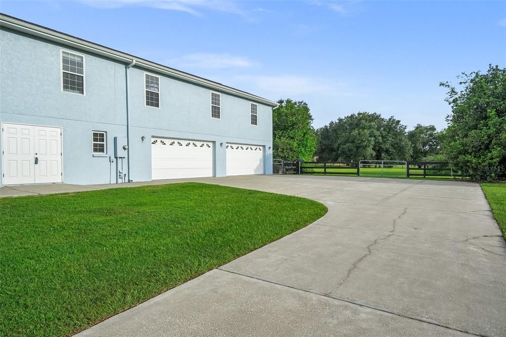 As you drive along the elongated driveway, you can't help but be captivated by the beautifully landscaped surroundings. The path leads you to a breathtaking 7,000 square foot home that leaves you in awe.