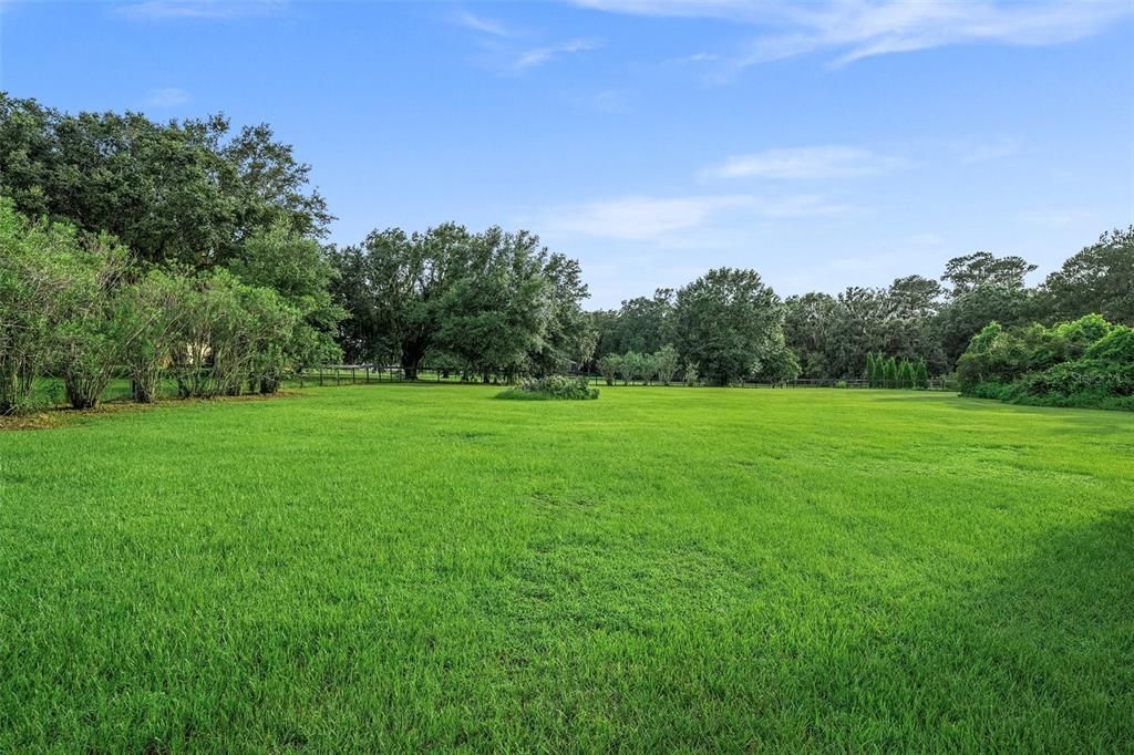 Experience the pleasure of 2.5 acres filled with lush greenery, offering the perfect space for farm animals and even the possibility of creating an equestrian property, should you desire to do so.