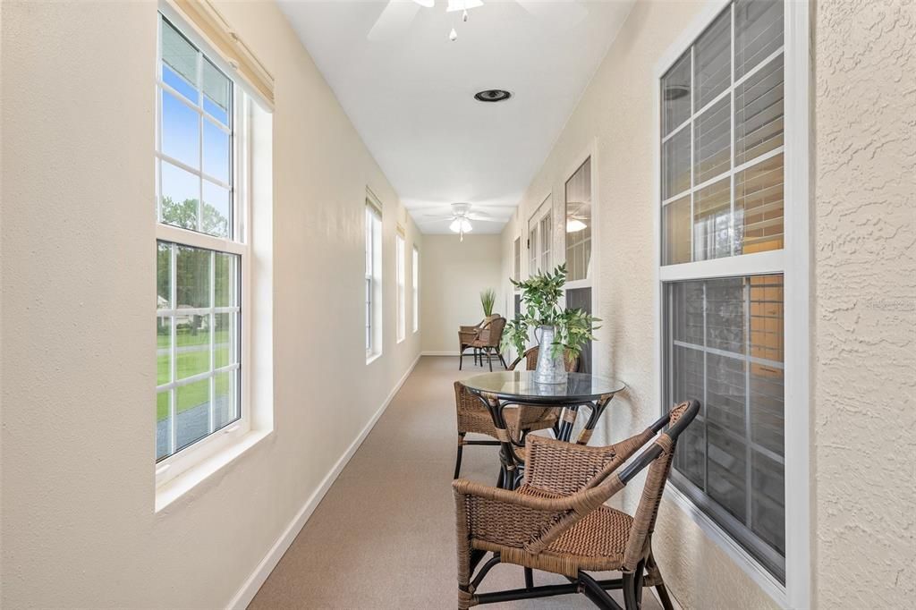 Spacious enclosed indoor balcony.