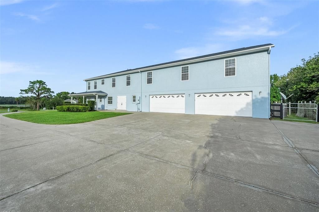 Car enthusiasts will delight in the spacious 4-car garage, while also benefiting from ample storage space provided by the expansive exterior storage room.