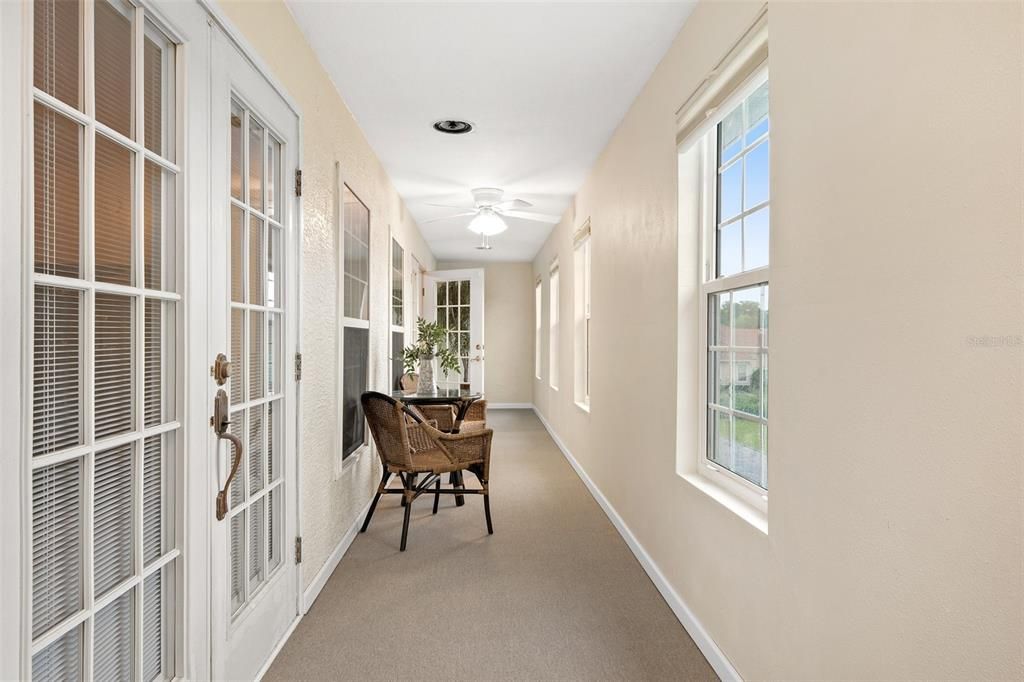 Spacious enclosed indoor balcony.