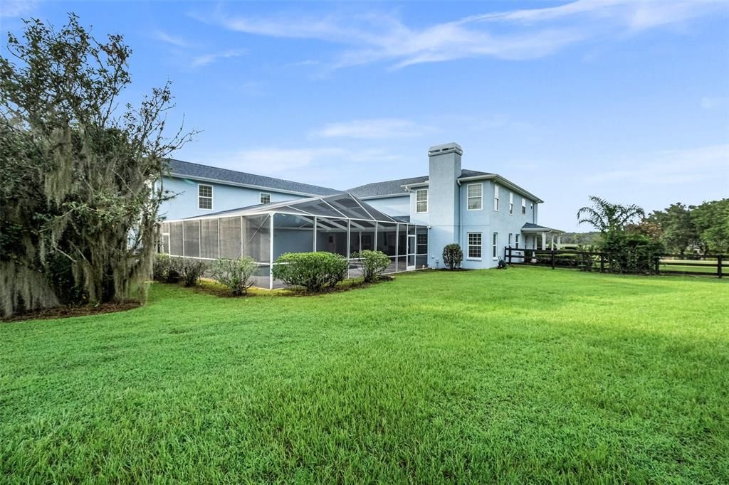 Experience the pleasure of 2.5 acres filled with lush greenery, offering the perfect space for farm animals and even the possibility of creating an equestrian property, should you desire to do so.