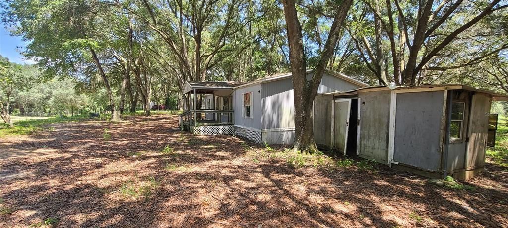 West side of home with shed