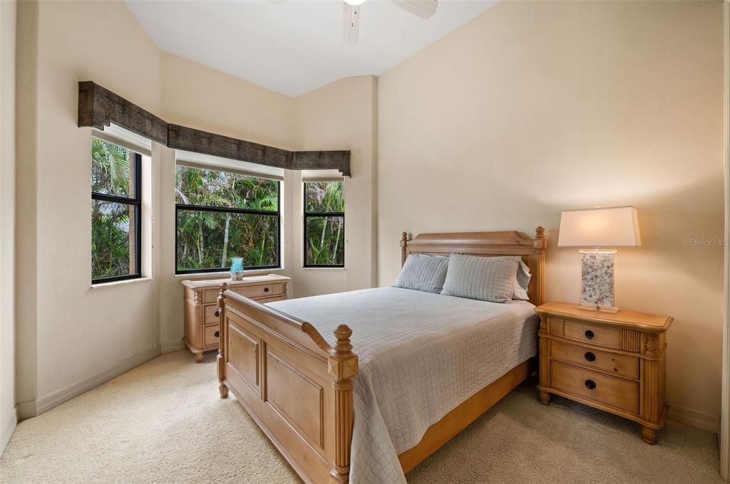 Bedroom 4 on the south side of the house with adjoining Pool Bath and Shower.