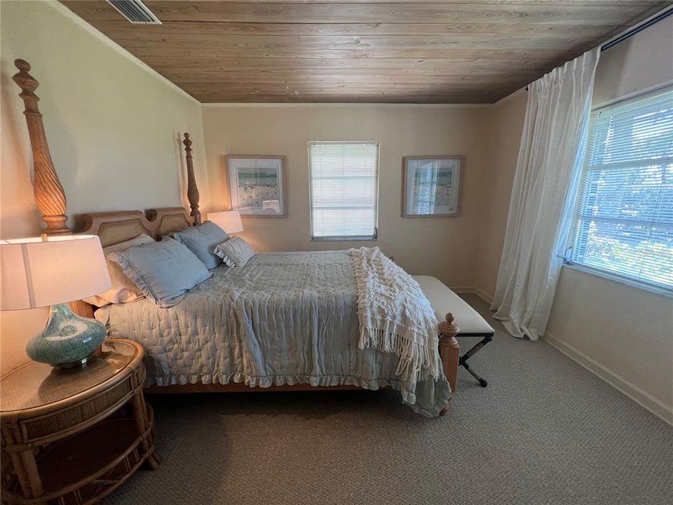 West side guest queen bedroom has a sunset view.