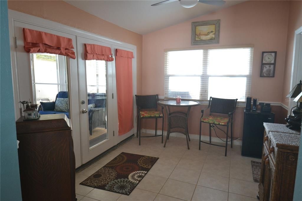 Office area or entertaining area before Main bedroom on the right.  Lanai on the left