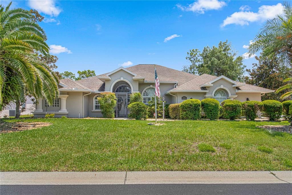 Front view of this gorgeous, Florida home on an oversized , corner lot!