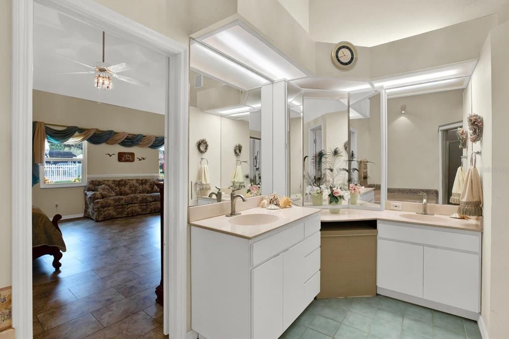 This large master bath has two sinks, a shower & a garden tub.