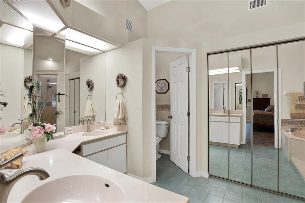 A large linen closet & a separate toilet room are great features in this bathroom.