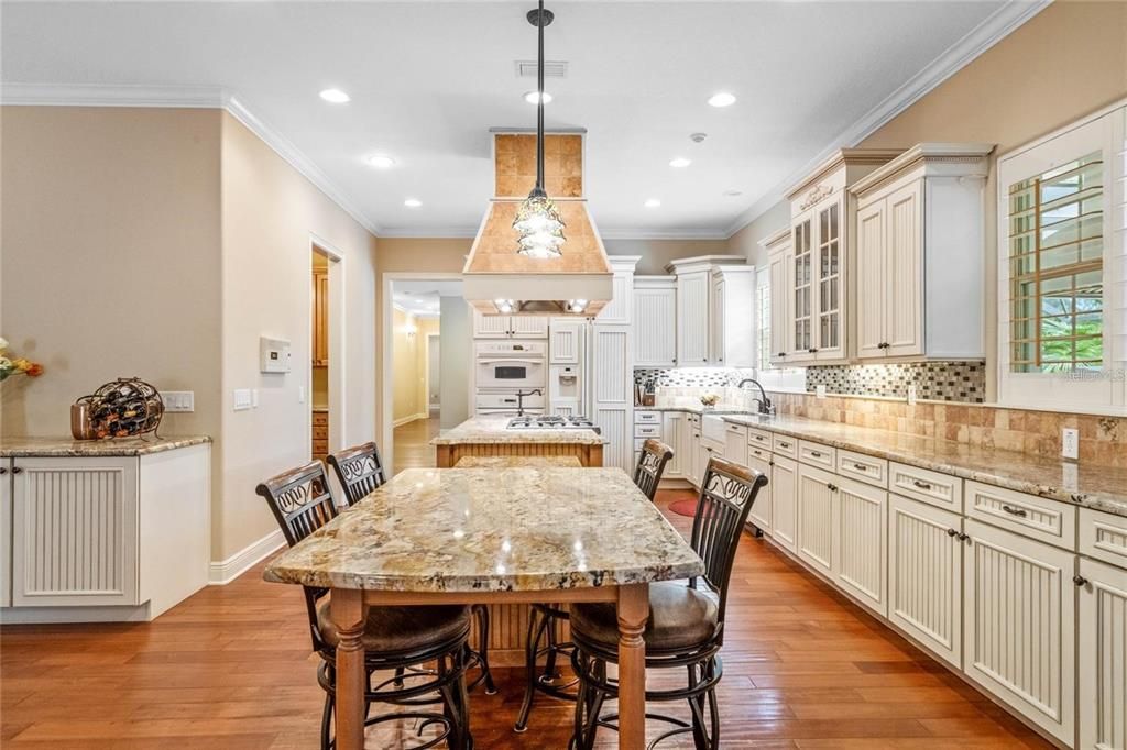 Amazing kitchen with informal eating bar completely open to family room