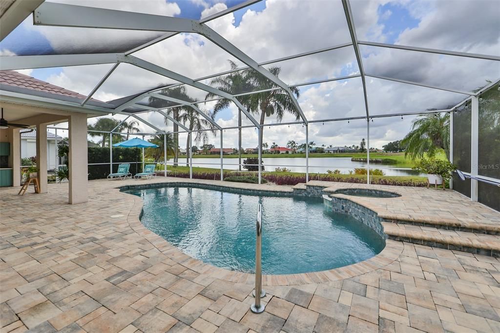 Oversized Outdoor Lanai with Solar Heated Saltwater Pool w/Spa Pond & Renaissance Golf Course view