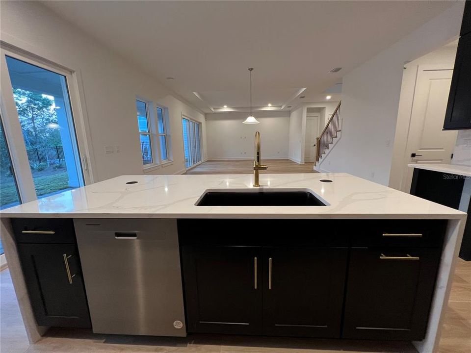 Gourmet Kitchen with waterfall island and double-stacked cabinetry