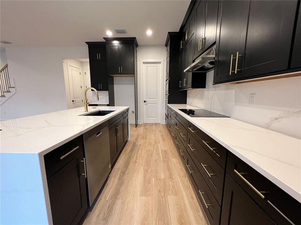 Gourmet Kitchen with waterfall island and double-stacked cabinetry