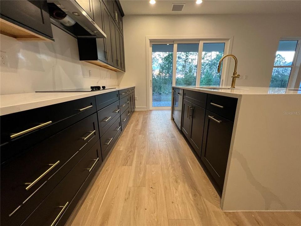 Gourmet Kitchen with waterfall island and double-stacked cabinetry