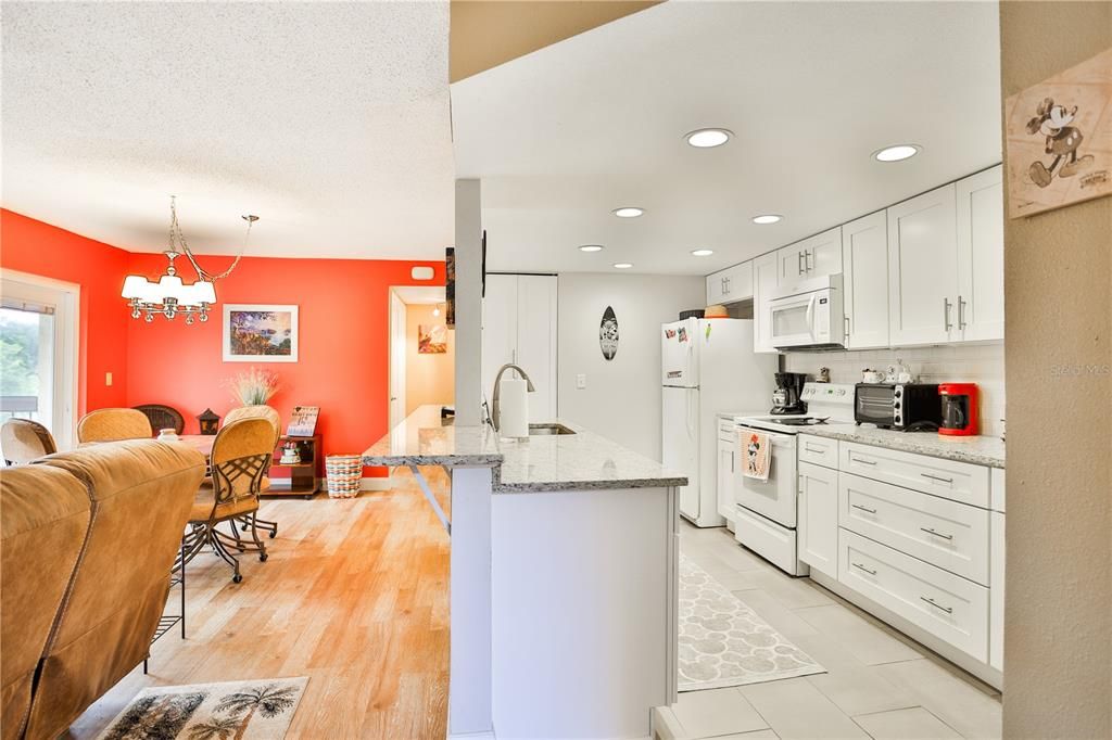 View of kitchen and great room from front door