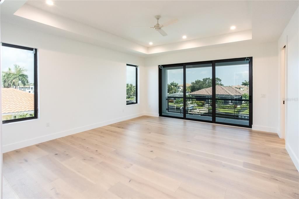 Primary suite with private terrace and recessed ceiling.