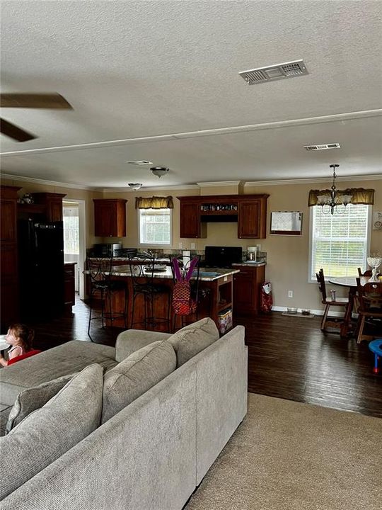 View of Kitchen & Dining Room from Entry