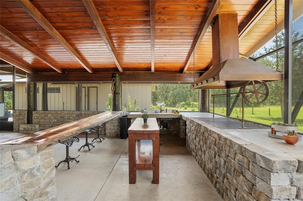 Outdoor Grill with rustic seating area