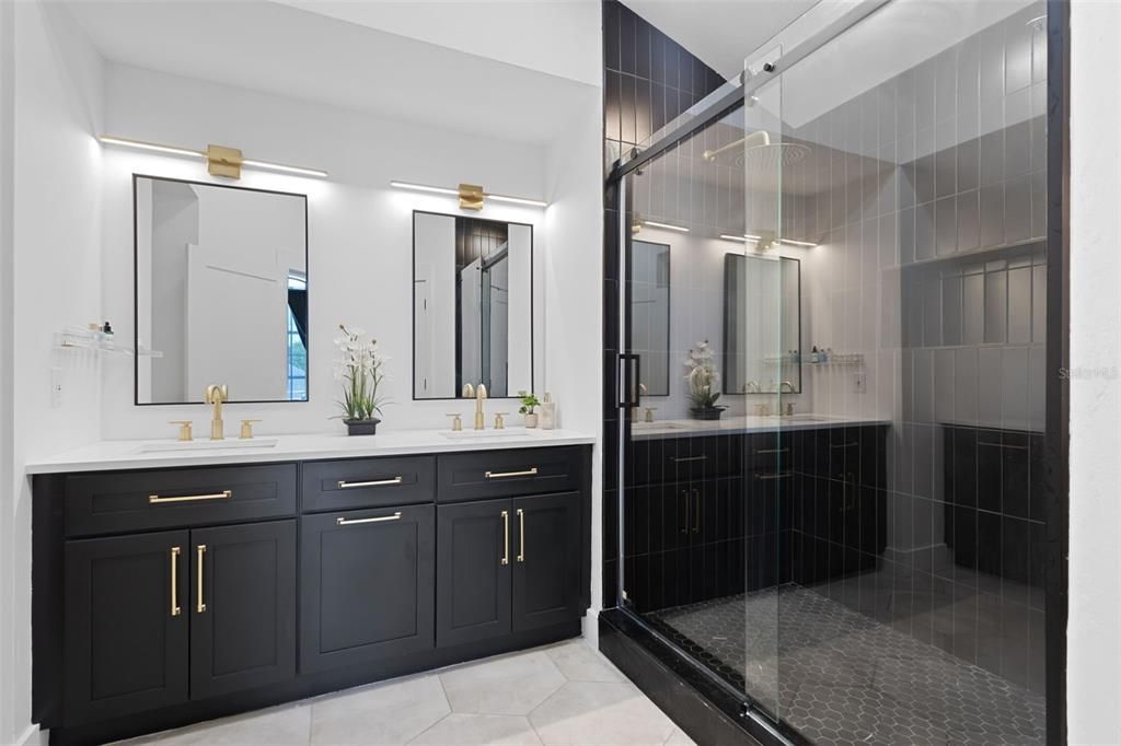Primary Bathroom with double vanity and walk in shower