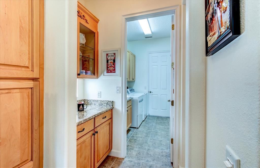 Coffee Bar/ Dry Bar Next to Kitchen and Dining Room. Laundry Room, With a Sink is Conveniently Located as You Enter the Home From the Garage