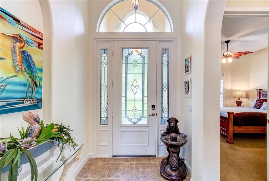 The Glass Entry Door is Flanked with Two Sidelights as Well as the Great Arched Window.