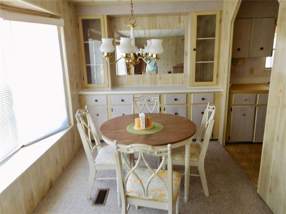 DINING ROOM WITH BUILT IN CHINA CABINET.