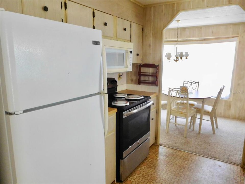 KITCHEN.AND VIEW OF DINING OOM.