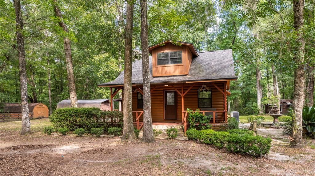 Welcome home to this completely remodeled Log Cabin on 5 acres.