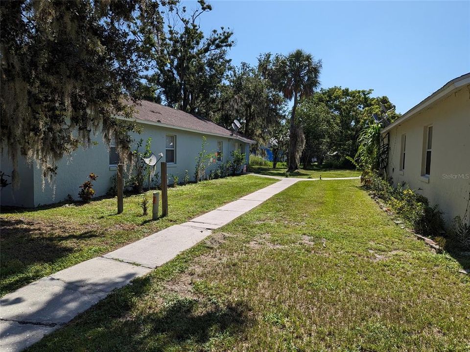 sidewalk between both buildings