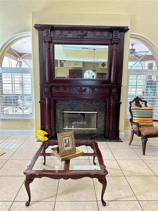 Custom decorative fireplace - plantation shutters