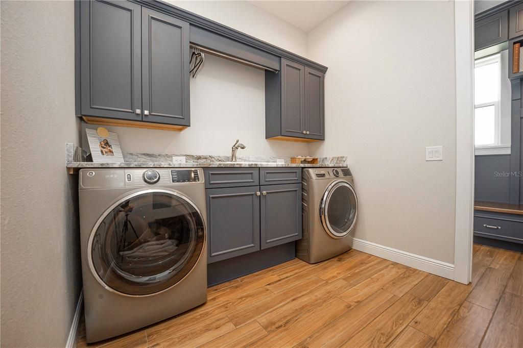 Spacious Laundry room with ample cabinet space