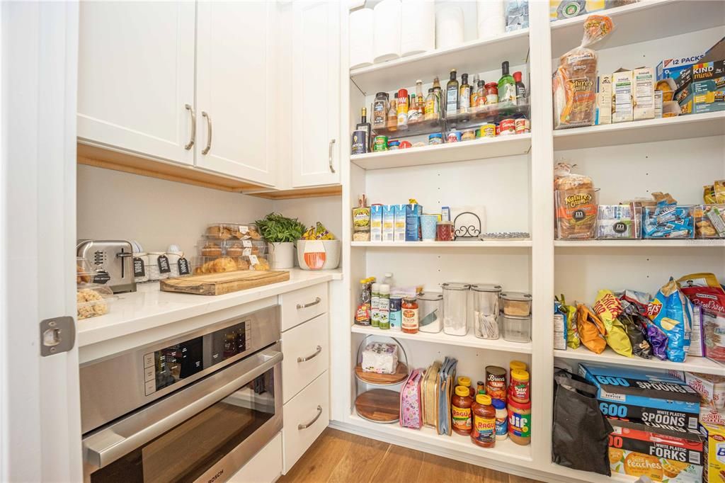Spacious Walk-in pantry with ample cabinet space!
