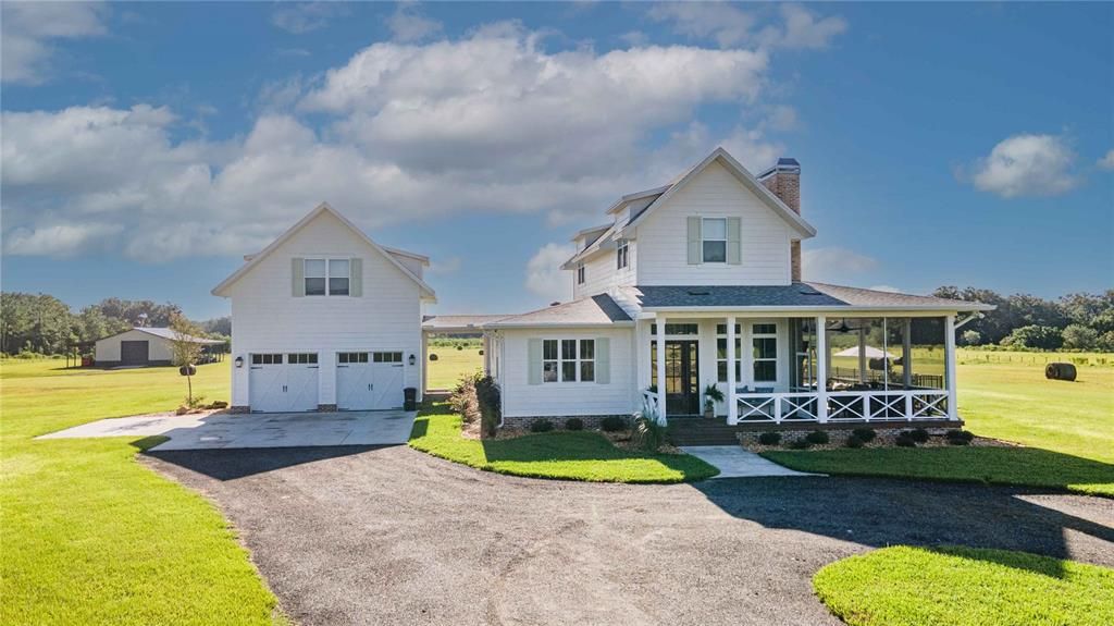 Exterior front of home with view of barn and attached garages