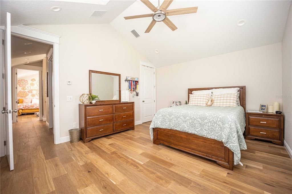 Spacious Guest Bedroom Upstairs with wood floors and walk-in closet