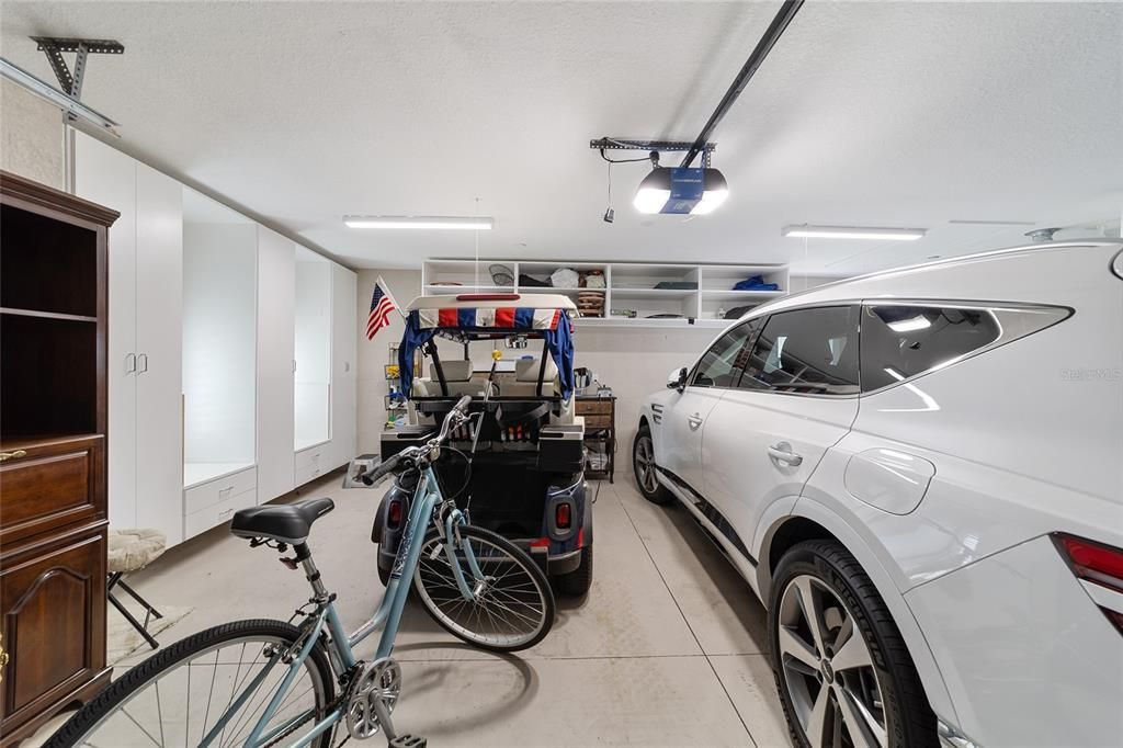 TILED GARAGE FLOOR. CABINETS GALORE & SO CLEAN