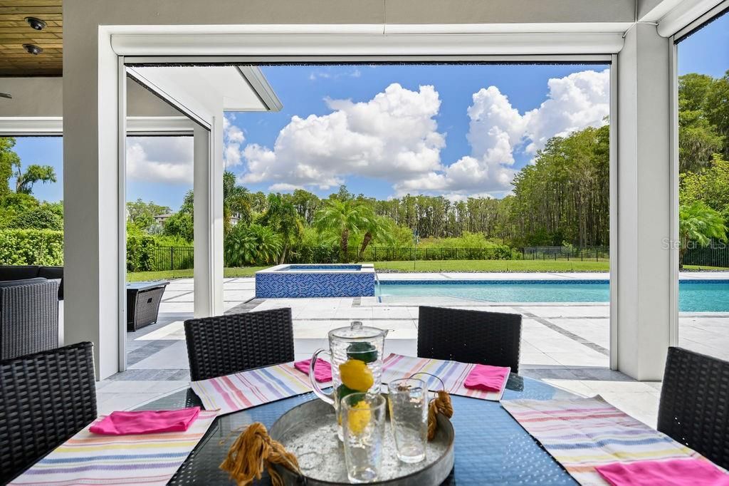 You can keep you eye on the pool while enjoying dinner at the adult table.