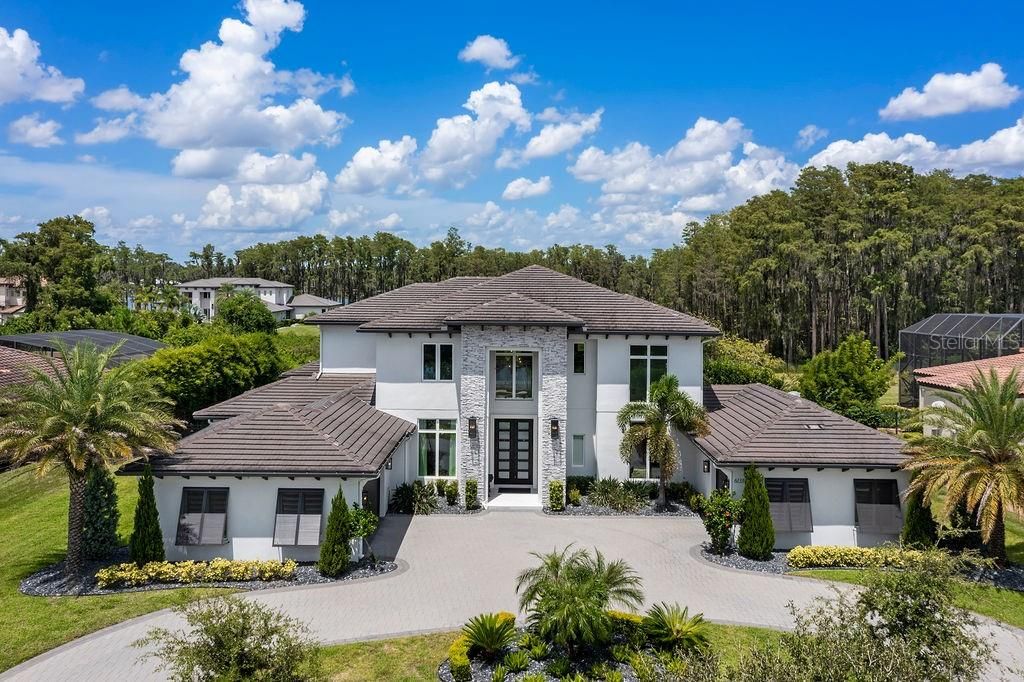 Welcome Home! This estate in Windermere's Waterstone gated community sits on over an acre and was completed in 2020.