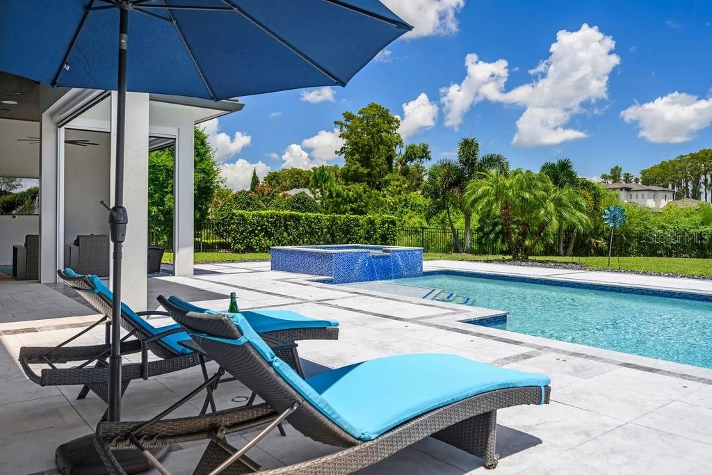 This view lets you appreciate the size and span of pool deck. Plenty of space for additional sun chairs.